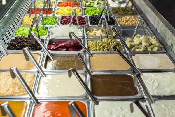 deli spread of salad and dressing